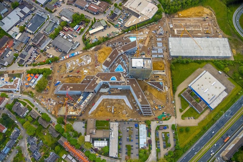 Aerial view, new construction and construction site ALDI-Nord Campus, Eckenbergstraße, Hängebank, Essen-Kray, Essen, Ruhr area, North Rhine-Westphalia, Germany, construction work, construction area, building site, building plots, construction crane, construction project, construction site, DE, development, Europe, commercial enterprises, commercial area, commercial park, commercial site, commercial use, industrial site, aerial photograph, aerial photography, aerial photography, new construction, overview, bird's eye view, bird's eye view, overview
