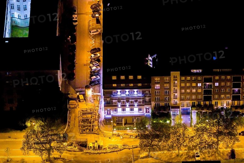 Aerial view, street construction site Zweigertstraße corner Kortumstraße at the district court Amtsgericht, Essen-Holsterhausen, Essen, Ruhr area, North Rhine-Westphalia, Germany, outdoor lighting, construction work, construction area, construction site, construction project, construction site, DE, twilight, Europe, light pollution, aerial photography, aerial photography, night aerial photography, streetlights, street lamps, overview, bird's-eye view, illuminated, illuminated houses, illuminated house, birds-eyes view, artificial light, night, nightflight, overview