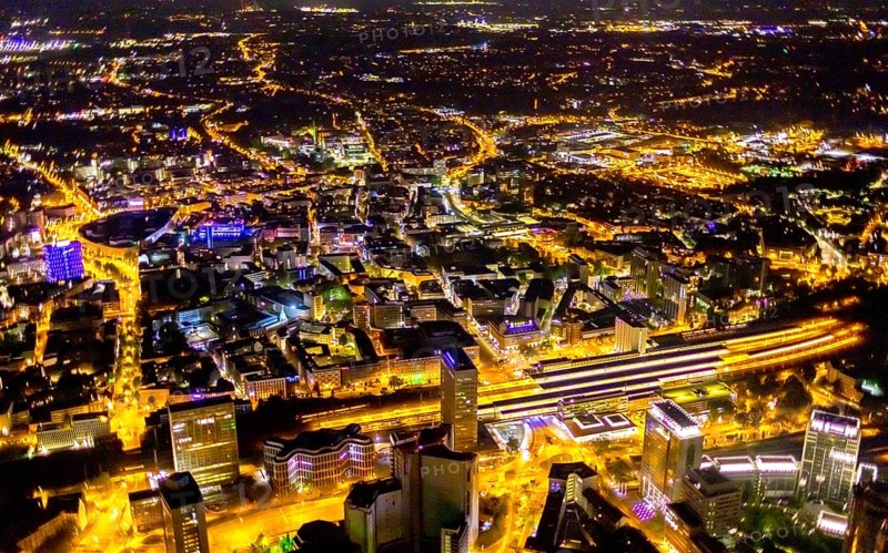 Aerial view, Essen central station, southern district, Essen, Ruhr area, North Rhine-Westphalia, Germany, outdoor lighting, railway station, DE, Deutsche Bahn AG, twilight, Europe, commercial buildings, central station, main station, light pollution, aerial photograph, aerial photography, aerial photography, night aerial photograph, streetlights, street lamps, overview, bird's eye view, illuminated, illuminated houses, illuminated house, birds-eyes view, artificial light, night, nightflight, overview