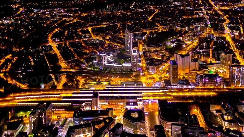 Aerial view, Essen central station, business district, Westenergie tower, demolition Ypsilon-Haus, Essen-Holsterhausen, Essen, Ruhr area, North Rhine-Westphalia, Germany, outdoor lighting, railway station, construction work, construction site, building site, construction project, construction site, DE, Deutsche Bahn AG, twilight, Europe, commercial buildings, central station, main station, light pollution, aerial view, aerial photography, aerial photography, night aerial photography, streetlights, street lamps, tower, overview, bird's eye view, illuminated, illuminated houses, illuminated house, birds-eyes view, artificial light, night, nightflight, overview