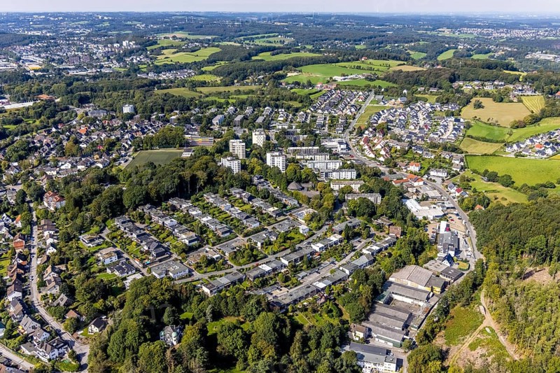 Aerial view, commercial area at Hembecker Talstraße and housing estate Büttenberger Straße in the district Büttenberg in Ennepetal, Ruhr area, North Rhine-Westphalia, Germany, tree mortality, bark beetle damage, bark beetle plague, DE, Ennepetal, Europe, spruce mortality, commercial enterprises, commercial area, commercial area, commercial site, commercial use, property tax, high-rise housing estate, real estate, industrial area, industrial site, clear-cutting, aerial view, aerial photography, aerial photography, overview, bird's-eye view, forest, forest damage, forest dieback, residential area, housing and living, residential area, residential buildings, housing quality, residential neighbourhood, housing estate, birds-eyes view, overview