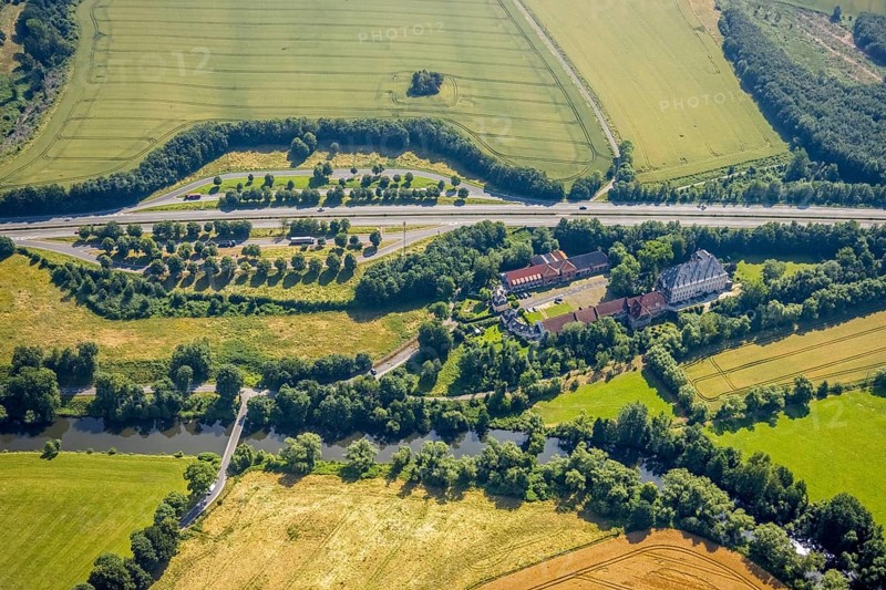 Aerial view, Haus Füchten, motorway A445 with parking Haus Füchten and parking Ruhr Valley, Hünningen, Ense, Sauerland, North Rhine-Westphalia, Germany, motorway A445, castle, DE, Europe, manor house, aerial view, aerial photography, aerial photography, parking, castle, overview, bird's eye view, farm building, birds-eyes view, historical sight, overview