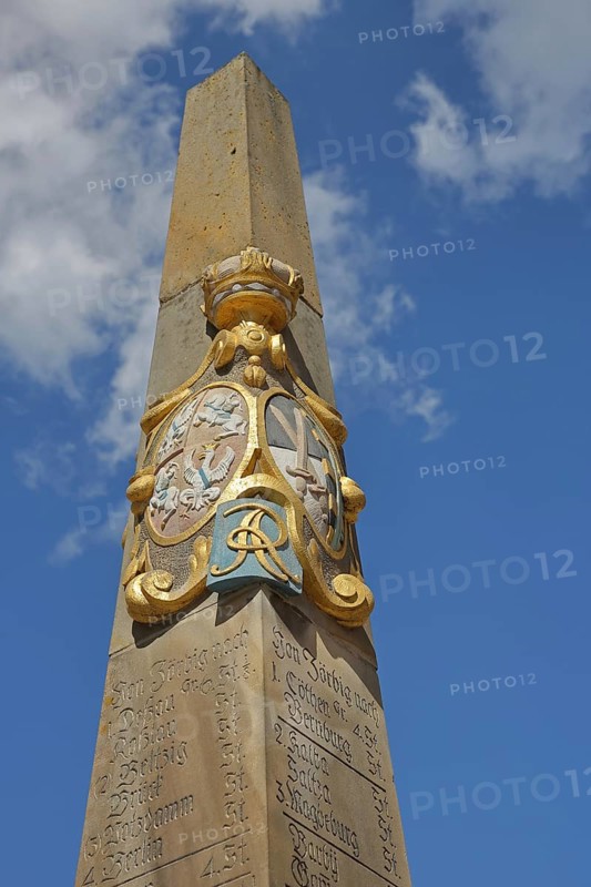 Electoral Saxon post pillar with city coat of arms and inscription with distance to cities, view upwards, detail, free-standing, Electoral Saxon, distance pillar, market, Zörbig, Saxony-Anhalt, Germany