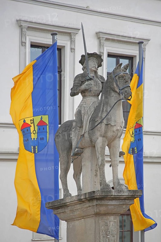Roland statue with town flags, sculpture, equestrian figure, equestrian statue, market square, town hall, Haldensleben, Saxony-Anhalt, Germany