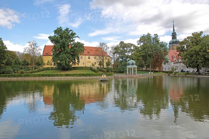 Castle and round pavilion at the spa park pond with church tower of the town church, reflection, Goethe School, Goethepark, Bad Lauchstädt, Saxony-Anhalt, Germany