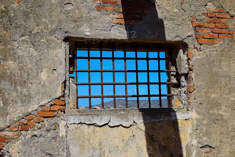 Barred window with shadows on old, rustic brick walls, Old silk factory, Military prison of the German Wehrmacht, Concentration camp, Lost Place, Kattavia, Rhodes, Dodecanese, Greek Islands, Greece