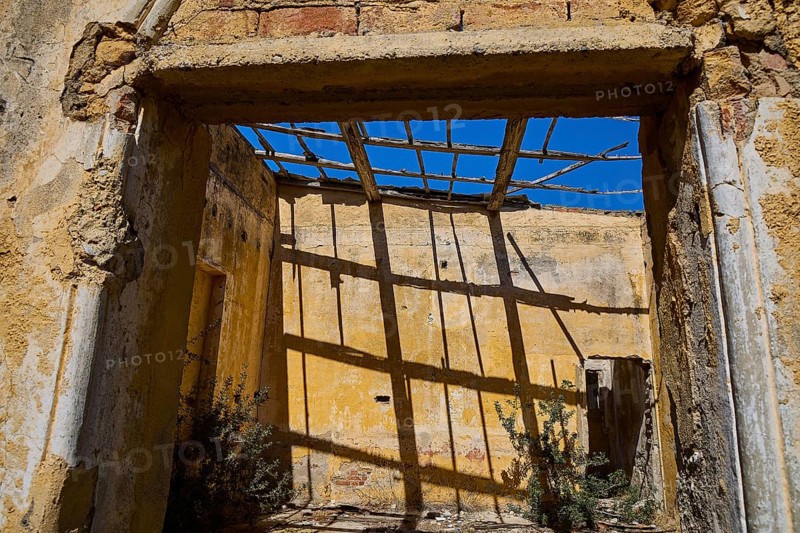 Sunlight casts shadows through dilapidated wooden beams in an old room, Old Silk Factory, German Wehrmacht military prison, concentration camp, Lost Place, Kattavia, Rhodes, Dodecanese, Greek Islands, Greece