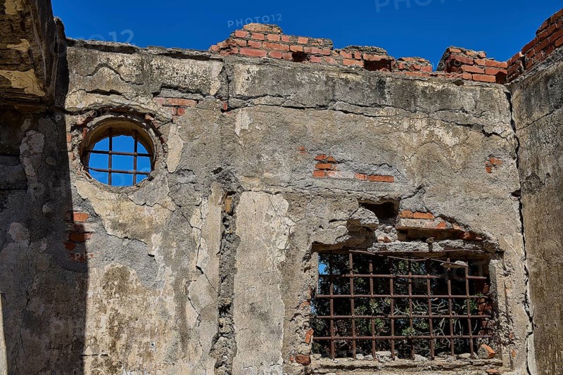 Old walls with round and rectangular lattice window, surrounded by bricks, Old silk factory, Military prison of the German Wehrmacht, Concentration camp, Lost Place, Kattavia, Rhodes, Dodecanese, Greek Islands, Greece