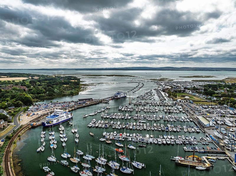 Wight Light car ferry to Isle of Wight on Lymington River and marina from drone, Lymington, New Forest, Hampshire, England, United Kingdom