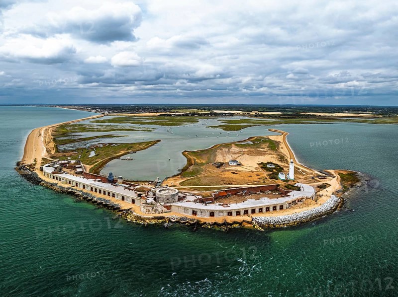 Hurst Point Lighthouse and Hurst Castle from drone over Hurst Spit, Milford on Sea, Lymington, Hampshire, England, United Kingdom