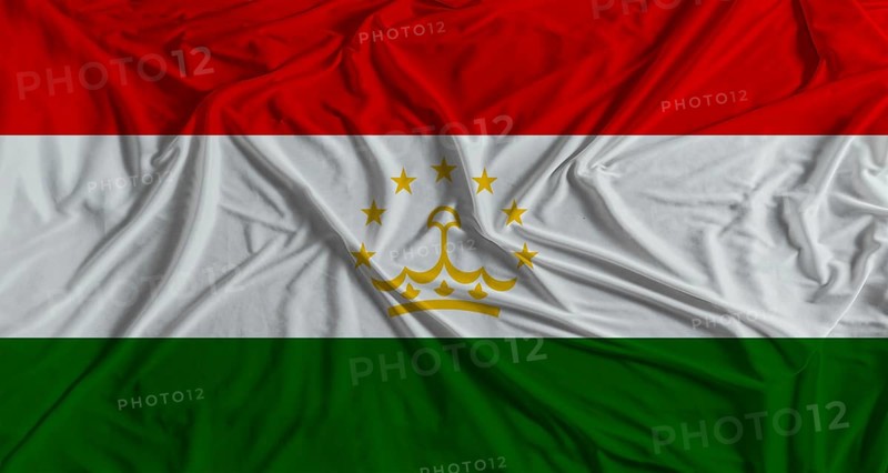Tajikistani flag with fabric texture background. National flag of Tajikistan with cloth texture