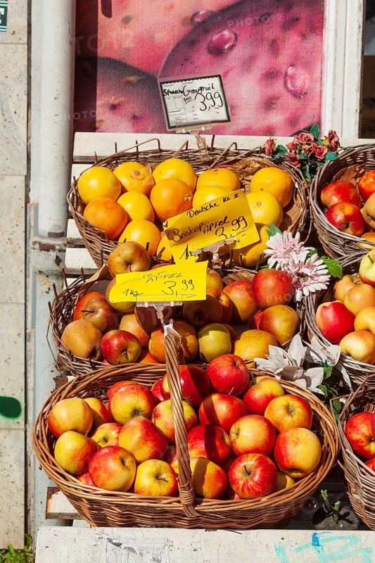 Fresh apples and fresh fruit with price tags in baskets in front of a greengrocer's shop, Bremen, Germany
