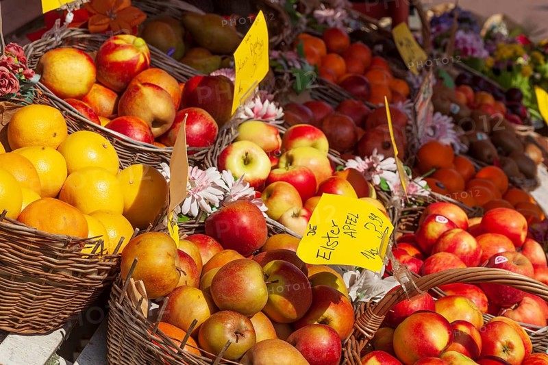Fresh apples and fresh fruit with price tags in baskets in front of a greengrocer's shop, Bremen, Germany