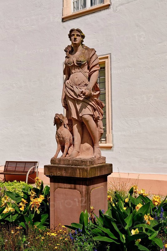Ettlingen, Germany - August 2025: Sculpture of hunting goddess Diana in the castle garden of Ettlingen