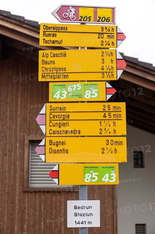 Signpost at the railway station, Staziun Sedrun, Surselva, Graubünden, Switzerland