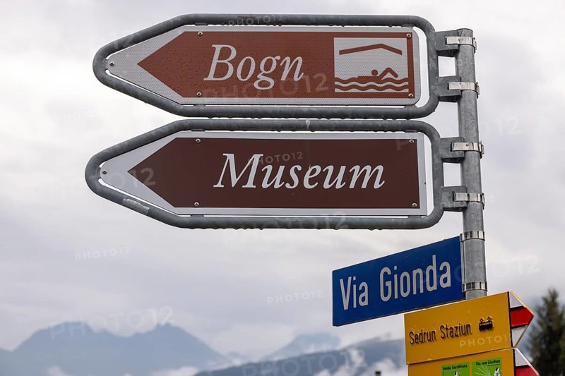 Signpost to the Bogn wellness and adventure pool and museum, Sedrun railway station, Surselva, Graubünden, Switzerland