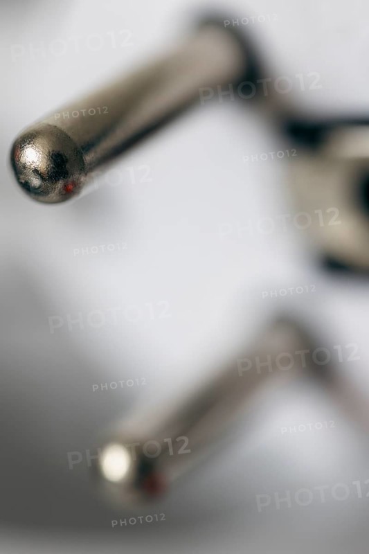 Close-up of a power plug, Schuko plug, with focus on the contact pins, symbol image for, electricity, electrical energy, power consumption, studio shot, Germany