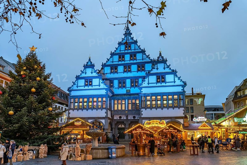 Christmas market at the colourfully illuminated Paderborn Town Hall at duskin Paderborn, North Rhine-Westphalia, Germany
