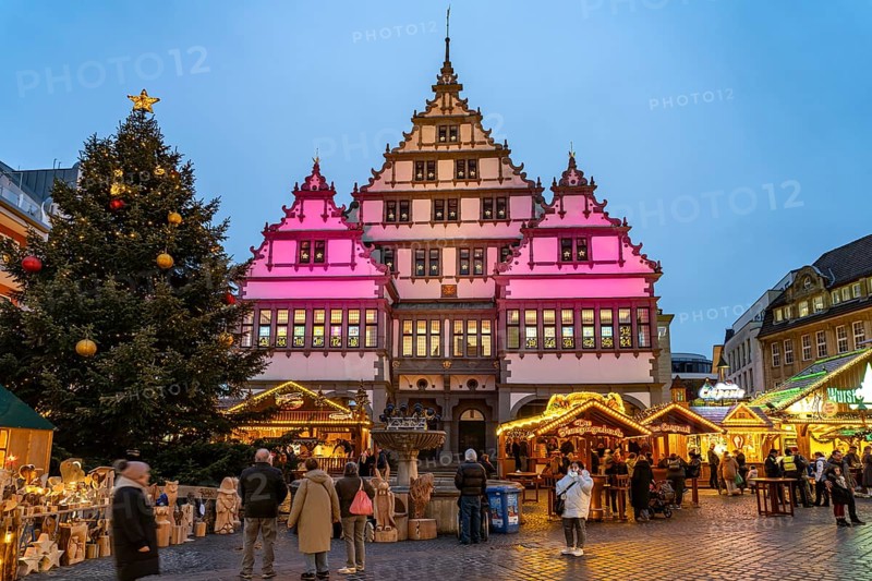 Christmas market at the colourfully illuminated Paderborn Town Hall at duskin Paderborn, North Rhine-Westphalia, Germany
