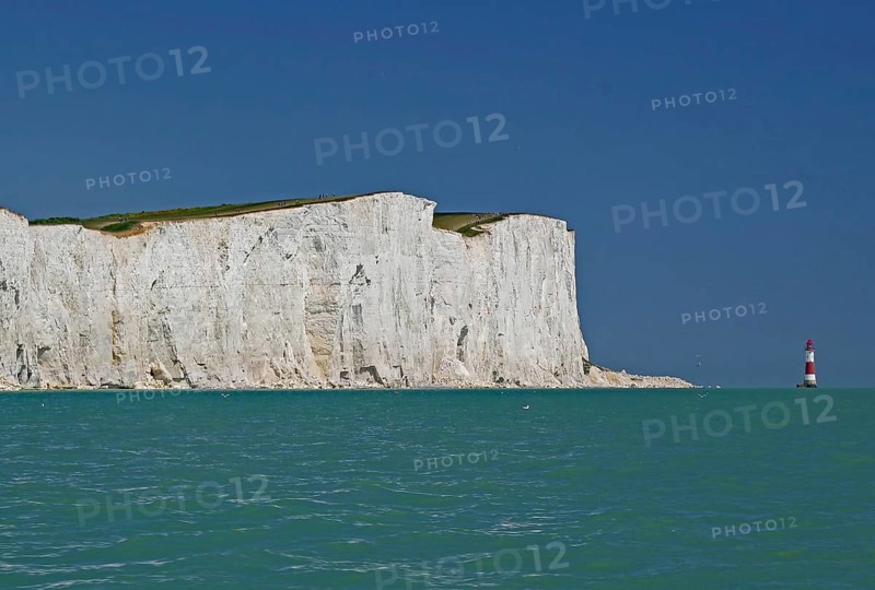 White cliffs on turquoise sea with view of red lighthouse, Old Harrys Rock, Beachy Head Lighthouse, Bournemouth, Dorset, England, Great Britain