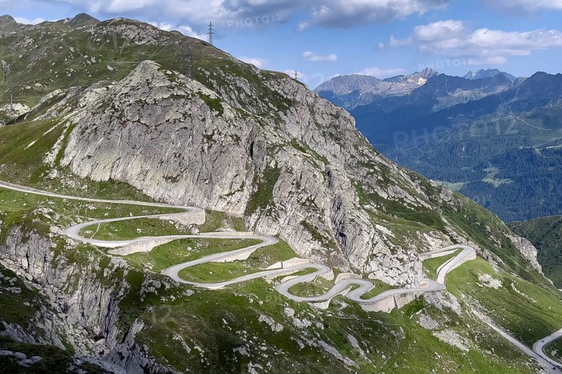 View from elevated position on serpentine hairpin bends of southern ramp southern ascent descent in southern part of old historic St. Gotthard pass road Tremola Gotthardpass Alpine pass mountain road with cobblestones, Swiss Alps, Airolo, Canton Ticino, Ticino, Switzerland