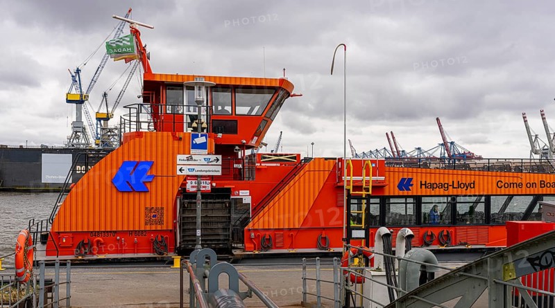 Hapag Lloyd ferry in orange, hvv ferry station at Dockland, fishing harbour, Hamburg, Germany