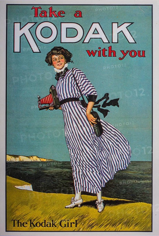 Old postcard. Woman advertising historic Kodak camera