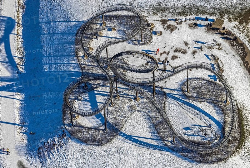 Aerial view, Tiger & Turtle - Magic Mountain, artwork, Wanheim-Angerhausen, Duisburg, Ruhr area, North Rhine-Westphalia, Germany, roller coaster model, Angerpark, DE, Ehinger Straße, Europe, shapes and colours, large sculpture, Heinrich-Hildebrand-Höhe, landmark, aerial view, aerial photography, aerial photography, snow, sight, overview, bird's eye view, winter, birds-eyes view, cleared roads, overview