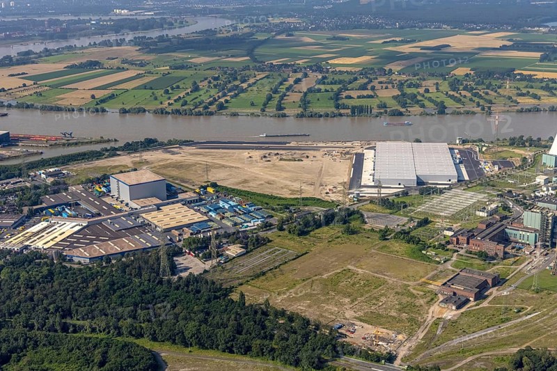 Aerial view, STEAG cogeneration plant Walsum, development and new warehouses logport VI, river Rhine, Alt-Walsum, Duisburg, Ruhr area, North Rhine-Westphalia, Germany, construction work, construction area, construction site, building plots, construction project, construction site, DE, development, Europe, industrial area, commercial area, commercial use, cogeneration plant, industrial facilities, industrial area, industrial site, capacity requirements, aerial view, aerial photography, aerial photography, new construction, overview, bird's-eye view, birds-eyes view, former Walsum colliery, logport VI, overview
