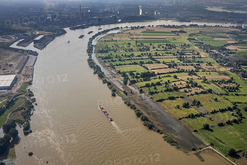 Aerial view, flood river Rhine at logport VI, ferry pier Rhine ferry Walsum, south harbour Walsum, container ships, Qalsum, Orsoy, Rheinberg, Ruhr area, North Rhine-Westphalia, Germany, DE, Duisburg, Europe, flood, flood of the century, aerial view, aerial photography, aerial photography, water level Duisburg, Rhine floodplain, Rhine flood, shipping traffic, heavy rain, overview, bird's eye view, bird's eye view, logport 6, logport VI, overview, flooding