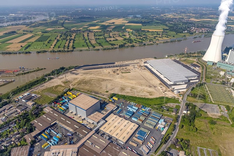Aerial view, STEAG cogeneration plant Walsum, development and new warehouses logport VI, river Rhine, Alt-Walsum, Duisburg, Ruhr area, North Rhine-Westphalia, Germany, construction work, construction area, construction site, building plots, construction project, construction site, DE, development, Europe, industrial area, commercial area, commercial use, cogeneration plant, industrial facilities, industrial area, industrial site, capacity requirements, aerial view, aerial photography, aerial photography, new construction, overview, bird's-eye view, birds-eyes view, former Walsum colliery, logport VI, overview
