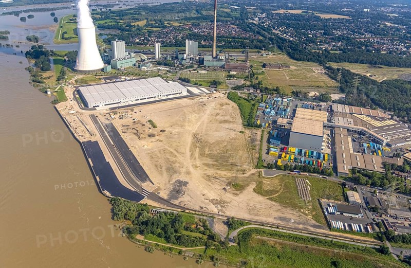 Aerial view, STEAG cogeneration plant Walsum, development and new warehouses logport VI, river Rhine, Alt-Walsum, Duisburg, Ruhr area, North Rhine-Westphalia, Germany, construction work, construction area, construction site, building plots, construction project, construction site, DE, development, Europe, industrial area, commercial area, commercial use, cogeneration plant, industrial facilities, industrial area, industrial site, capacity requirements, aerial view, aerial photography, aerial photography, new construction, overview, bird's-eye view, birds-eyes view, former Walsum colliery, logport VI, overview
