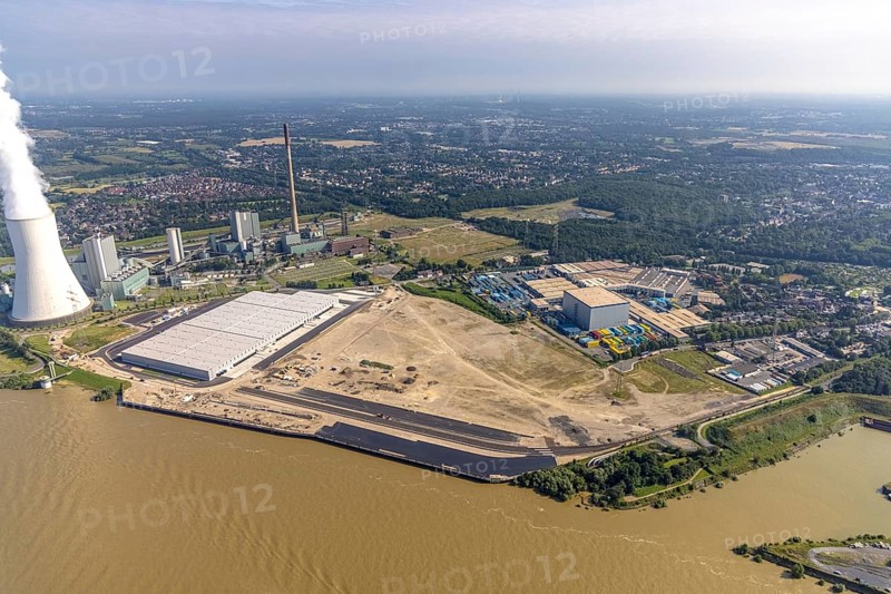 Aerial view, STEAG cogeneration plant Walsum, development and new warehouses logport VI, river Rhine, Alt-Walsum, Duisburg, Ruhr area, North Rhine-Westphalia, Germany, construction work, construction area, construction site, building plots, construction project, construction site, DE, development, Europe, industrial area, commercial area, commercial use, cogeneration plant, industrial facilities, industrial area, industrial site, capacity requirements, aerial view, aerial photography, aerial photography, new construction, overview, bird's-eye view, birds-eyes view, former Walsum colliery, logport VI, overview
