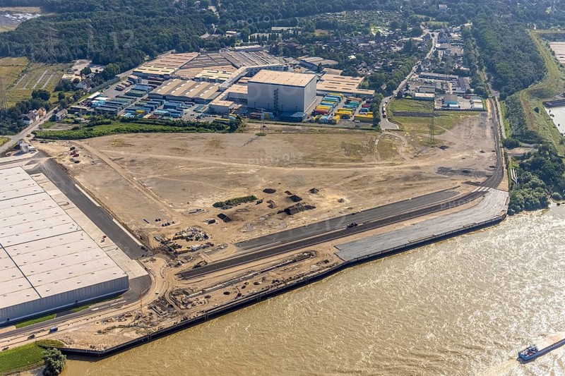Aerial view, STEAG cogeneration plant Walsum, development and new warehouses logport VI, river Rhine, Alt-Walsum, Duisburg, Ruhr area, North Rhine-Westphalia, Germany, construction work, construction area, construction site, building plots, construction project, construction site, DE, development, Europe, industrial area, commercial area, commercial use, cogeneration plant, industrial facilities, industrial area, industrial site, capacity requirements, aerial view, aerial photography, aerial photography, new construction, overview, bird's-eye view, birds-eyes view, former Walsum colliery, logport VI, overview