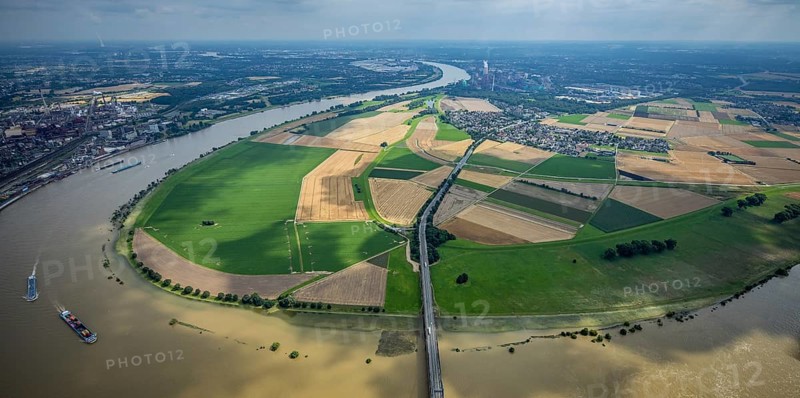 Aerial view, Krefeld-Uerdingen bridge, flood river Rhine, flooding Rhine floodplain Mündelheim, Rhine bend, Rhine floodplain Ehingen, Duisburg, Mündelheim, Ürdingen, Krefeld, Ruhr area, North Rhine-Westphalia, Germany, bridge, DE, Europe, flood, flood of the century, aerial view, aerial photography, aerial photography, water level Duisburg, Rhine flood, heavy rain, overview, bird's eye view, overview, flooding