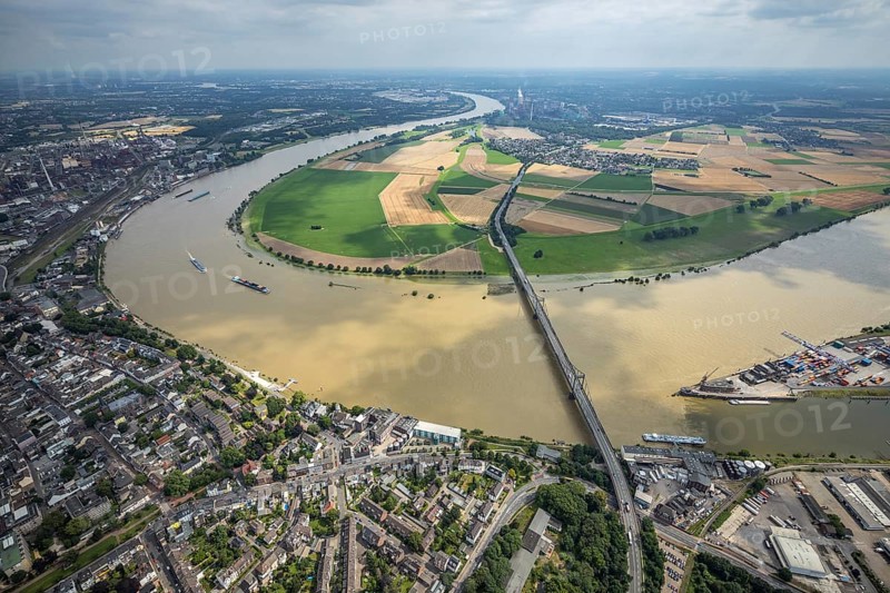 Aerial view, Krefeld-Uerdingen bridge, flood river Rhine, flooding Rhine floodplain Mündelheim, Rhine bend, Rhine floodplain Ehingen, Duisburg, Mündelheim, Ürdingen, Krefeld, Ruhr area, North Rhine-Westphalia, Germany, bridge, DE, Europe, flood, flood of the century, aerial view, aerial photography, aerial photography, water level Duisburg, Rhine flood, heavy rain, overview, bird's eye view, overview, flooding