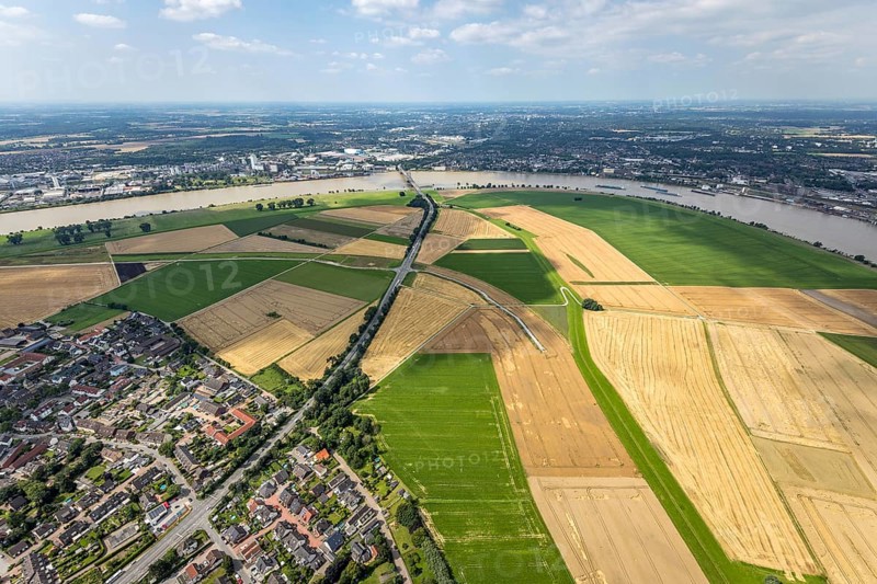 Aerial view, Rhine meadows Mündelheim and Rheinaue Ehingen, river Rhine Rhine arch, Uerdinger Rhine bridge, Mündelheim, Duisburg, Ruhr area, North Rhine-Westphalia, Germany, inland navigation, bridge, DE, Europe, river, river course, suspension bridge, Krefeld-Uerdinger bridge, Krefelder Straße, landscape conservation area, aerial view, aerial photography, aerial photography, Rhine arch, overview, bird's-eye view, birds-eyes view, overview