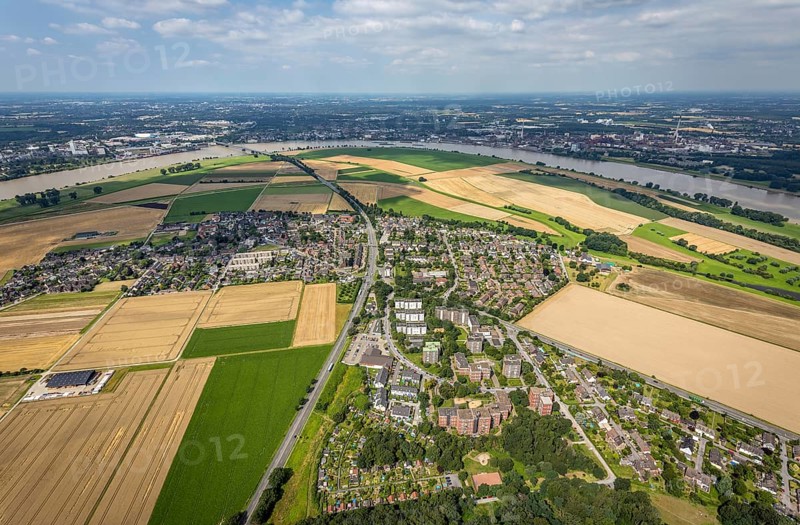 Aerial view, Rhine meadows Mündelheim and Rheinaue Ehingen, river Rhine Rhine arch, Uerdinger Rhine bridge, Mündelheim, Duisburg, Ruhr area, North Rhine-Westphalia, Germany, inland navigation, bridge, DE, Europe, river, river course, suspension bridge, Krefeld-Uerdinger bridge, Krefelder Straße, landscape conservation area, aerial view, aerial photography, aerial photography, Rhine arch, overview, bird's-eye view, birds-eyes view, overview