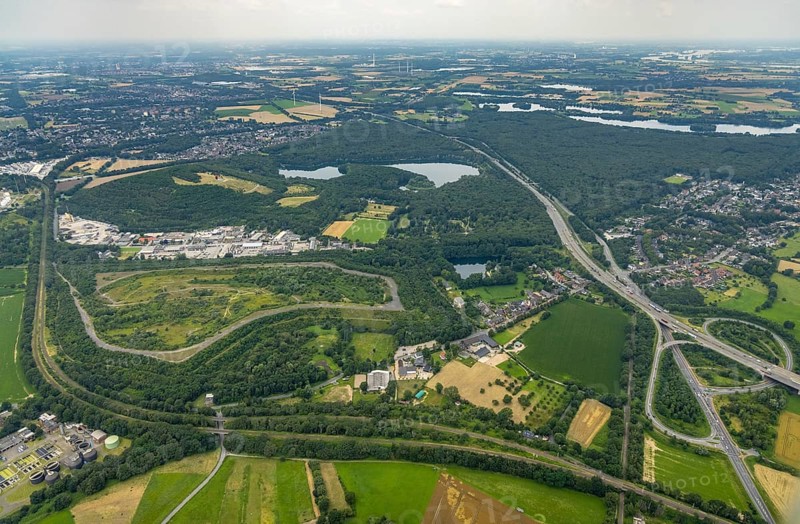 Aerial view, brownfield site Lohmannsheide spoil tip on Grafschafter Straße for planned hazardous waste landfill, Rheinpreussen spoil tip on forest lake, Gutenbergstraße industrial estate, Bärl, Duisburg, Ruhr area, North Rhine-Westphalia, Germany, spoil tip, DE, Europe, commercial enterprises, commercial area, commercial area, commercial site, commercial use, spoil tip, spoil tip landscape, spoil tip sign, industrial area, industrial site, landmark, aerial view, aerial photography, aerial photography, overview, bird's-eye view, birds-eyes view, overview