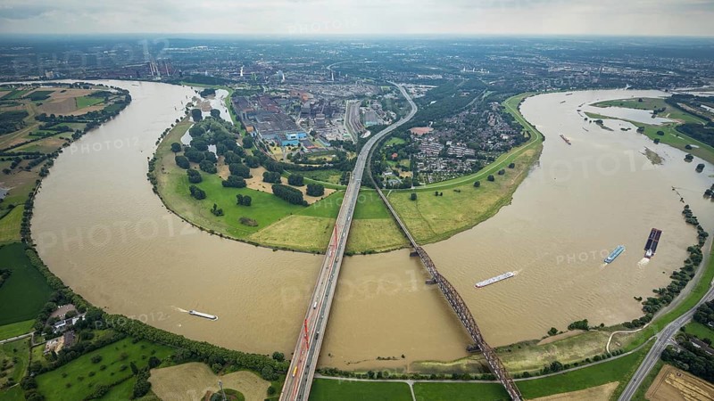Aerial view, flood river Rhine, motorway A42 Beeckerwerther Brücke and Haus-Knipp-Eisenbahnbrücke with view of Beeckerwerth, Rheinbogen, Bärl, Duisburg, Ruhr area, North Rhine-Westphalia, Germany, motorway, bridge, DE, Europe, flood, flood of the century, aerial view, aerial photography, aerial photography, aerial photography, gauge Duisburg, Rhine flood, heavy rain, overview, bird's-eye view, overview, flooding