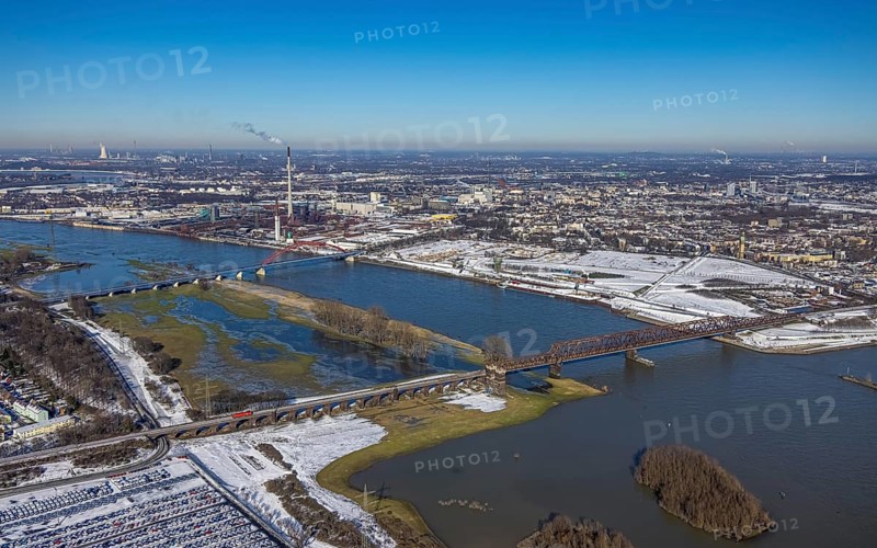 Aerial view, Rheinhausen bridge tower with Hochfeld railway bridge, Rhine river, demolition of wire rolling mill for new Rheinort district, Rhine river and flooding, Friemersheim, Duisburg, Ruhr area, North Rhine-Westphalia, Germany, bridge, bridge of solidarity, DE, Europe, shapes and colours, aerial view, aerial photography, aerial photography, snow, overview, bird's-eye view, winter, birds-eyes view, cleared roads, overview