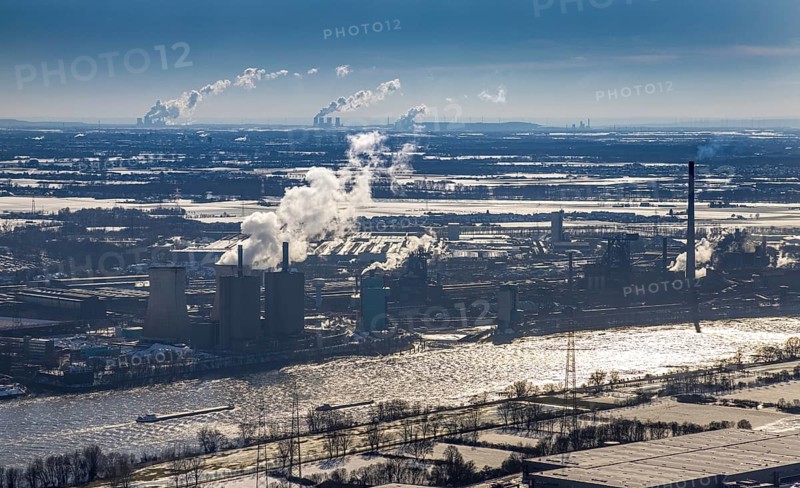 Aerial view, Hüttenwerke Krupp Mannesmann and Huckingen power station backlit, river Rhine, Friemersheim, Duisburg, Ruhr area, North Rhine-Westphalia, Germany, DE, steam, Europe, commercial enterprises, commercial area, commercial area, commercial location, commercial use, industrial area, industrial location, aerial view, aerial photography, aerial photography, smoke, snow, overview, bird's eye view, winter, birds-eyes view, cleared roads, overview