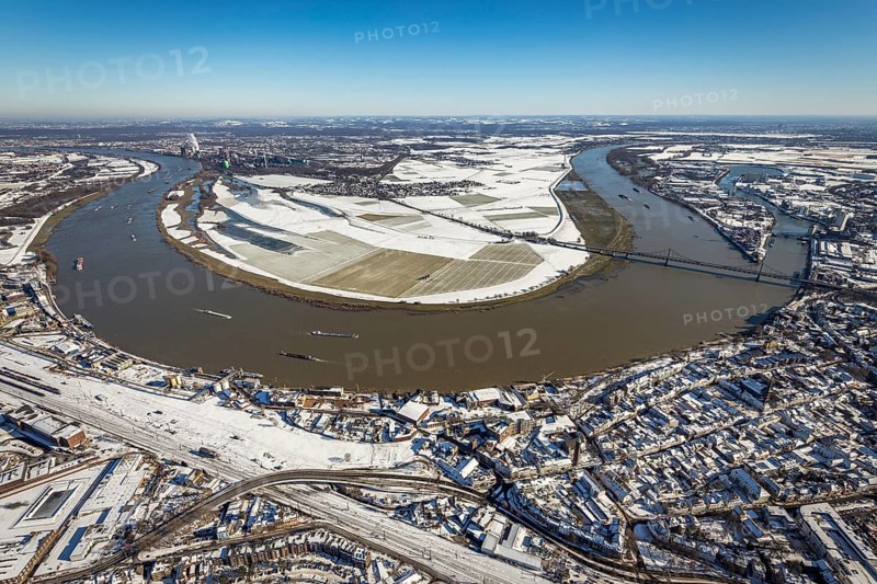 Aerial view, river Rhine, Rheinaue Ehingen with view of Mündelheim, Krefeld-Uerdingen bridge, snow-covered meadows and fields, Ürdingen, Krefeld, Ruhr area, North Rhine-Westphalia, Germany, DE, Europe, freight transport, cargo ships, aerial view, aerial photography, aerial photography, shipping, snow, overview, bird's eye view, meadows and fields, winter, birds-eyes view, cleared roads, overview