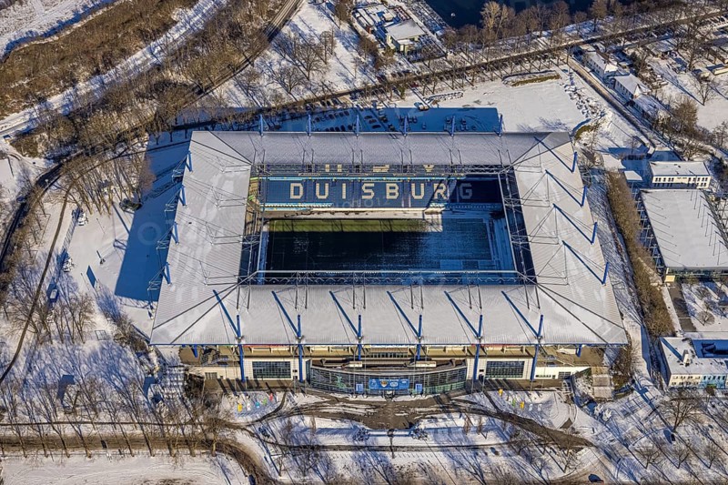 Aerial view, football stadium Schauinsland-Reisen-Arena, MSV Duisburg Arena, Sportpark Duisburg, Duisburg, Ruhr area, North Rhine-Westphalia, Germany, Arena, DE, Europe, leisure area, football pitch, football stadium, football club, aerial view, aerial photography, aerial photography, snow, sports, sports facilities, sports area, Sportpark Wedau, sports field, sports facility, stadium, overview, bird's eye view, winter, birds-eyes view, cleared roads, overview