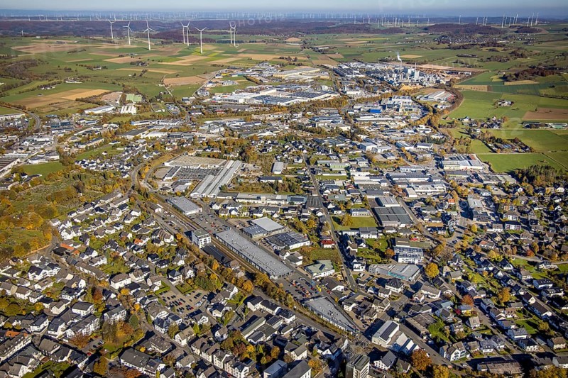 Aerial view, industrial area Brilon with Egger Holzwerkstoffe GmbH and wind farm in the background in Brilon, Sauerland, North Rhine-Westphalia, Germany, Brilon, DE, Europe, distant view, commercial enterprises, commercial area, commercial area, commercial location, commercial use, industrial area, industrial building, industrial site, aerial view, aerial photography, aerial photography, town view, townscape, overview, bird's-eye view, WEA, wind energy, wind energy plant, wind power, wind power plant, wind farm, wind turbines, birds-eyes view, overview