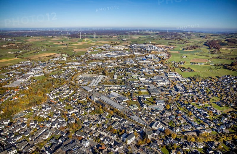 Aerial view, industrial area Brilon with Egger Holzwerkstoffe GmbH and wind farm in the background in Brilon, Sauerland, North Rhine-Westphalia, Germany, Brilon, DE, Europe, distant view, commercial enterprises, commercial area, commercial area, commercial location, commercial use, industrial area, industrial building, industrial site, aerial view, aerial photography, aerial photography, town view, townscape, overview, bird's-eye view, WEA, wind energy, wind energy plant, wind power, wind power plant, wind farm, wind turbines, birds-eyes view, overview