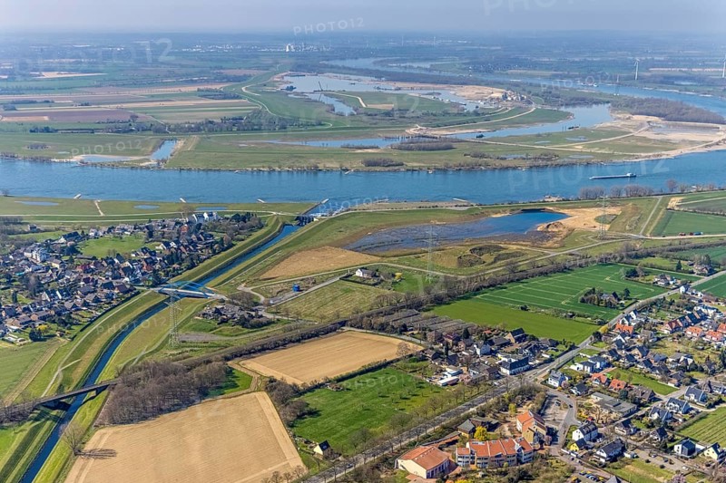 Aerial view, Rhine dyke construction site, Emscher estuary, Emscher estuary drop structure, Emscher bridge Hagelstraße, Rheinaue Walsum, river Emscher, river Rhine, city border to Voerde, Eppinghoven, Dinslaken, Ruhr area, North Rhine-Westphalia, Germany, DE, Emscher, Emscher estuary into the Rhine, Emscher conversion, Europe, Frankfurter Straße, aerial view, aerial photography, aerial photography, estuary, Lower Rhine, Rhine, Rhine floodplain, overview, bird's-eye view, meadows and fields, living and life, birds-eyes view, new Emscher estuary Voerde city boundary, overview