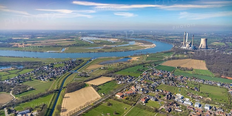 Aerial view, Rhine dyke construction site, Emscher estuary, Emscher estuary drop structure, decommissioned Voerde power plant, Emscher bridge Hagelstraße, Rheinaue Walsum Dinslaken, river Emscher, river Rhine, city limits of Voerde, Eppinghoven, Dinslaken, Ruhr area, North Rhine-Westphalia, Germany, DE, Emscher, Emscher estuary into the Rhine, Emscher conversion, Europe, Frankfurter Straße, power station, aerial photography, aerial photography, estuary area, Lower Rhine, Rhine, Rhine floodplain, overview, bird's eye view, meadows and fields, living and life, birds-eyes view, new Emscher estuary Voerde city boundary, overview