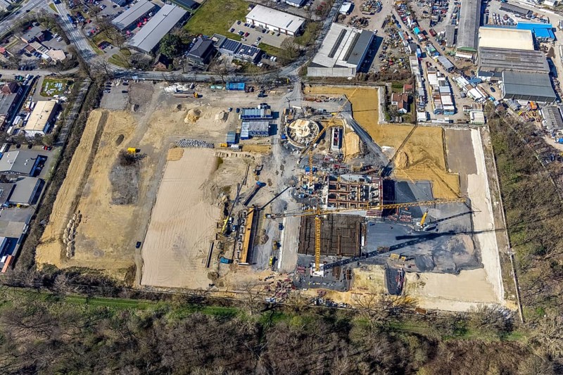Aerial view, construction site new wood-fired power station at Thyssenstraße, Averbruch, Dinslaken, Ruhr area, North Rhine-Westphalia, Germany, architectural office Gramlich und Partner, construction work, building, construction area, building site, building plots, construction project, construction site, DE, Europe, cogeneration plant, power station, aerial view, aerial photography, aerial photography, new building, Lower Rhine, Rhine, overview, bird's-eye view, overview