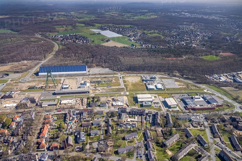 Aerial view, Bergpark Lohberg, former Lohberg colliery site, winding tower, water tower, Lohberg colliery workshop, Oberlohberg, Dinslaken, Ruhr area, North Rhine-Westphalia, Germany, construction area, construction site, construction project, CO2-neutral site, DE, Europe, design concept, commercial area, commercial use, green area, Hünxer Straße, industrial plants, industrial area, industrial site, Lohberg power station, Lohberg creative quarter, roundabout, culture, aerial view, aerial photography, aerial photography, Lower Rhine, Ober-Lohberg-Allee, park, overview, bird's-eye view, birds-eyes view, former Lohberg coal mine, former colliery site, creative use, cultural use, overview